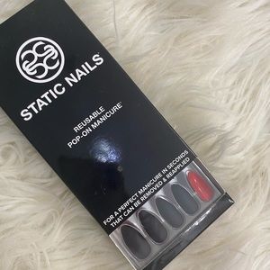 Static Nails never opened in black with red back.